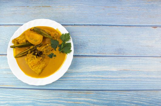 Spicy and tasty fish curry dish, Traditional Malaysian cuisine. Selective focus.