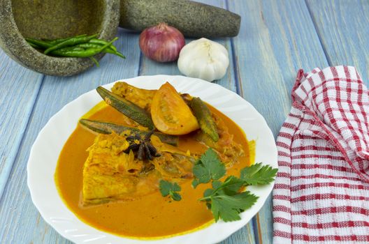 Spicy and tasty fish curry dish, Traditional Malaysian cuisine. Selective focus.