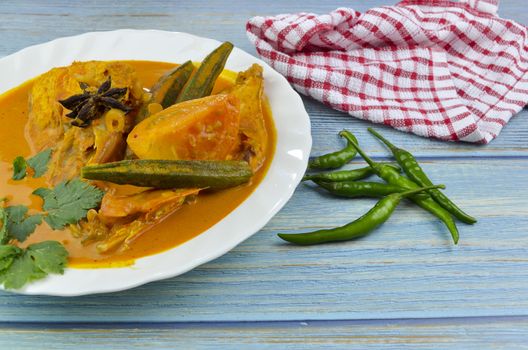 Spicy and tasty fish curry dish, Traditional Malaysian cuisine. Selective focus.