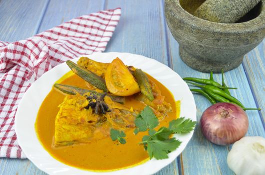 Spicy and tasty fish curry dish, Traditional Malaysian cuisine. Selective focus.