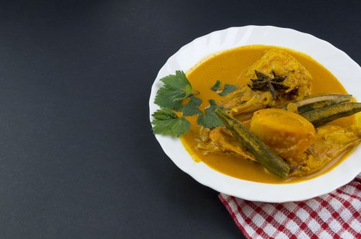 Spicy and tasty fish curry dish, Traditional Malaysian cuisine. Selective focus.