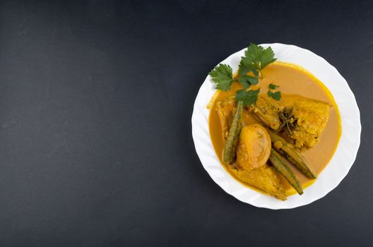 Spicy and tasty fish curry dish, Traditional Malaysian cuisine. Selective focus.