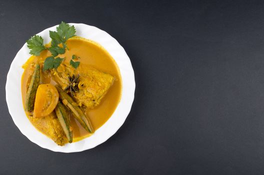 Spicy and tasty fish curry dish, Traditional Malaysian cuisine. Selective focus.