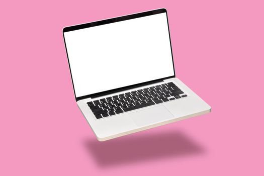 laptop computer mock up with empty blank white screen isolated on pink background. float or levitate laptop notebook with shadow. modern computer technology concept