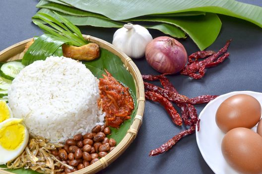 Nasi Lemak is a commonly found food in Malaysia, Brunei and Singapore. It is also an unofficial national food in Malaysia. Selective focus.