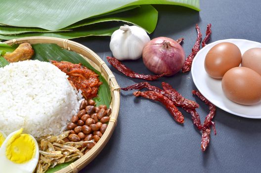 Nasi Lemak is a commonly found food in Malaysia, Brunei and Singapore. It is also an unofficial national food in Malaysia. Selective focus.