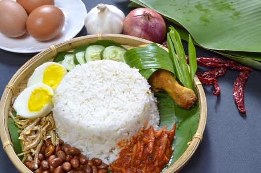 Nasi Lemak is a commonly found food in Malaysia, Brunei and Singapore. It is also an unofficial national food in Malaysia. Selective focus.