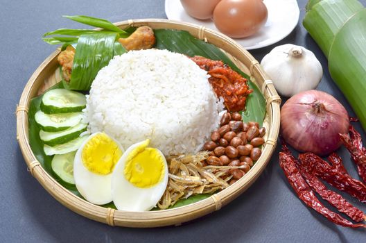 Nasi Lemak is a commonly found food in Malaysia, Brunei and Singapore. It is also an unofficial national food in Malaysia. Selective focus.