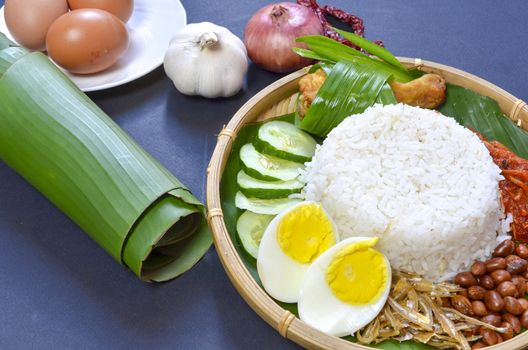 Nasi Lemak is a commonly found food in Malaysia, Brunei and Singapore. It is also an unofficial national food in Malaysia. Selective focus.