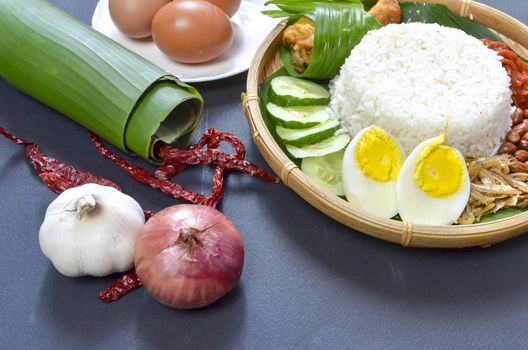 Nasi Lemak is a commonly found food in Malaysia, Brunei and Singapore. It is also an unofficial national food in Malaysia. Selective focus.