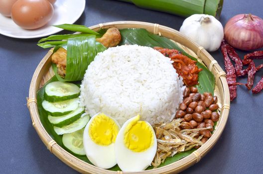 Nasi Lemak is a commonly found food in Malaysia, Brunei and Singapore. It is also an unofficial national food in Malaysia. Selective focus.