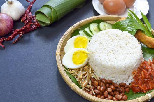 Nasi Lemak is a commonly found food in Malaysia, Brunei and Singapore. It is also an unofficial national food in Malaysia. Selective focus.