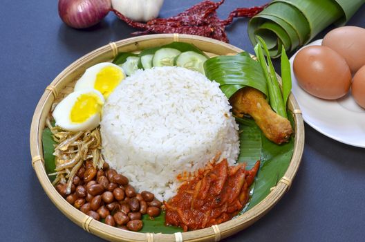 Nasi Lemak is a commonly found food in Malaysia, Brunei and Singapore. It is also an unofficial national food in Malaysia. Selective focus.