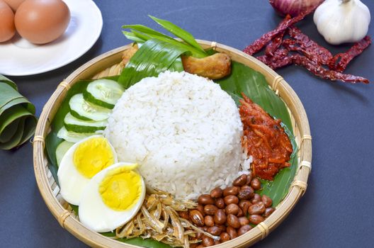 Nasi Lemak is a commonly found food in Malaysia, Brunei and Singapore. It is also an unofficial national food in Malaysia. Selective focus.