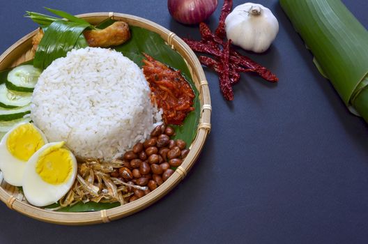 Nasi Lemak is a commonly found food in Malaysia, Brunei and Singapore. It is also an unofficial national food in Malaysia. Selective focus.