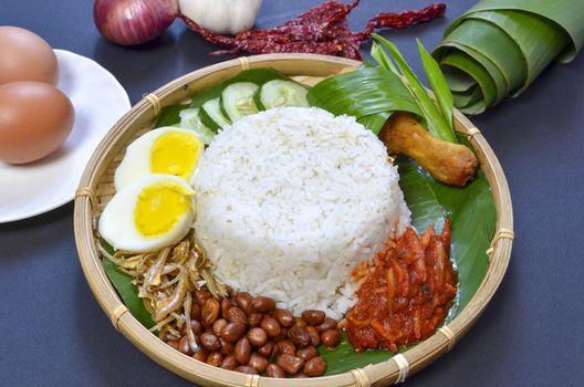 Nasi Lemak is a commonly found food in Malaysia, Brunei and Singapore. It is also an unofficial national food in Malaysia. Selective focus.