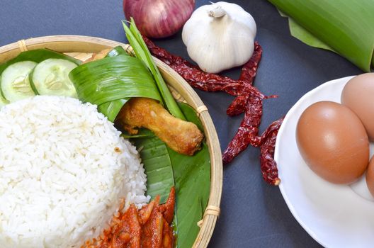 Nasi Lemak is a commonly found food in Malaysia, Brunei and Singapore. It is also an unofficial national food in Malaysia. Selective focus.