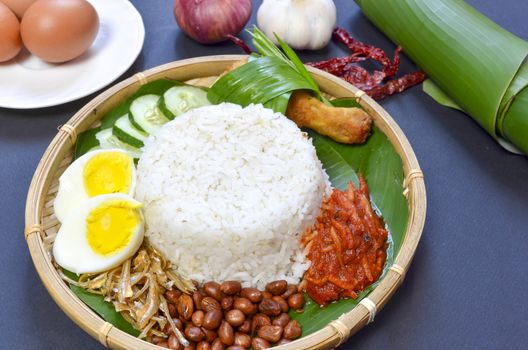 Nasi Lemak is a commonly found food in Malaysia, Brunei and Singapore. It is also an unofficial national food in Malaysia. Selective focus.