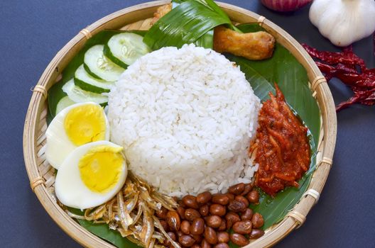 Nasi Lemak is a commonly found food in Malaysia, Brunei and Singapore. It is also an unofficial national food in Malaysia. Selective focus.