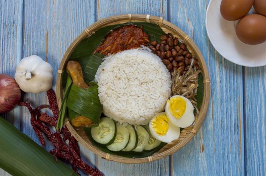 Nasi Lemak is a commonly found food in Malaysia, Brunei and Singapore. It is also an unofficial national food in Malaysia. Selective focus.