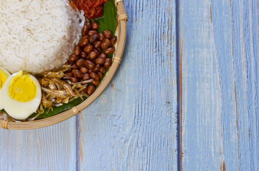 Nasi Lemak is a commonly found food in Malaysia, Brunei and Singapore. It is also an unofficial national food in Malaysia. Selective focus.