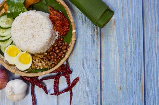 Nasi Lemak is a commonly found food in Malaysia, Brunei and Singapore. It is also an unofficial national food in Malaysia. Selective focus.