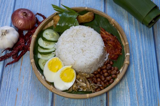 Nasi Lemak is a commonly found food in Malaysia, Brunei and Singapore. It is also an unofficial national food in Malaysia. Selective focus.