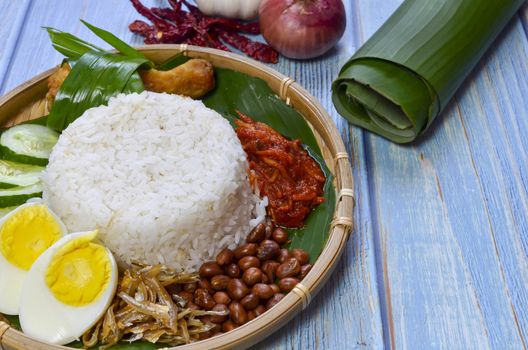 Nasi Lemak is a commonly found food in Malaysia, Brunei and Singapore. It is also an unofficial national food in Malaysia. Selective focus.