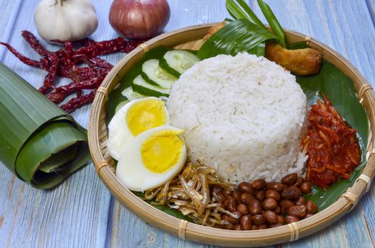 Nasi Lemak is a commonly found food in Malaysia, Brunei and Singapore. It is also an unofficial national food in Malaysia. Selective focus.