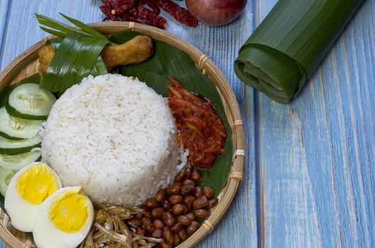 Nasi Lemak is a commonly found food in Malaysia, Brunei and Singapore. It is also an unofficial national food in Malaysia. Selective focus.