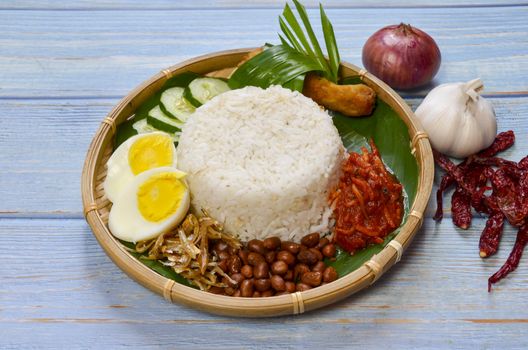 Nasi Lemak is a commonly found food in Malaysia, Brunei and Singapore. It is also an unofficial national food in Malaysia. Selective focus.