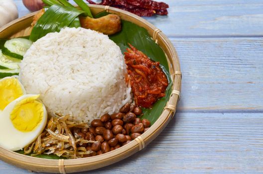 Nasi Lemak is a commonly found food in Malaysia, Brunei and Singapore. It is also an unofficial national food in Malaysia. Selective focus.