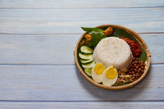 Nasi Lemak is a commonly found food in Malaysia, Brunei and Singapore. It is also an unofficial national food in Malaysia. Selective focus.