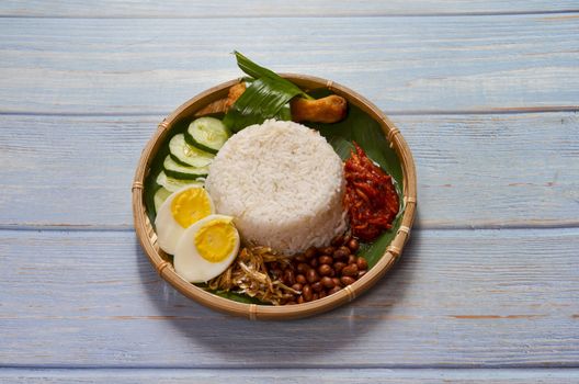 Nasi Lemak is a commonly found food in Malaysia, Brunei and Singapore. It is also an unofficial national food in Malaysia. Selective focus.