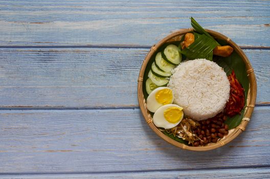 Nasi Lemak is a commonly found food in Malaysia, Brunei and Singapore. It is also an unofficial national food in Malaysia. Selective focus.