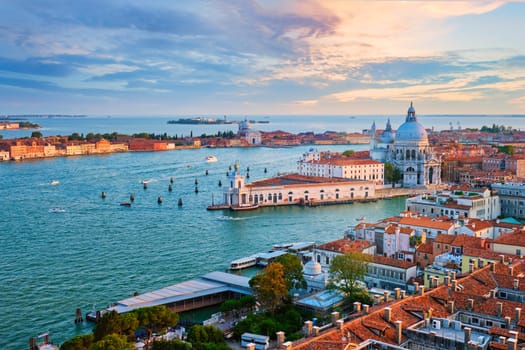 Aerial view of Venice lagoon and Santa Maria della Salute church on sunset. Venice, Italy