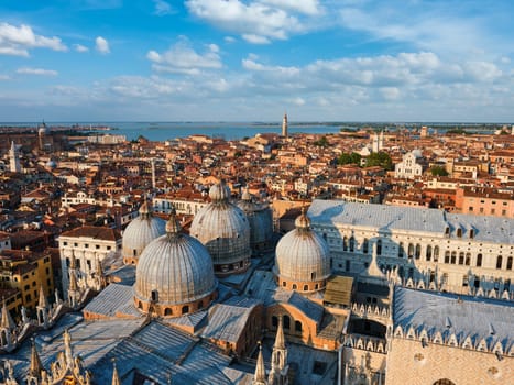 View of Venice with famous St Mark's Basilica and Doge's Palace on sunset from St Mark's Campanile bell tower, Venice, Italy