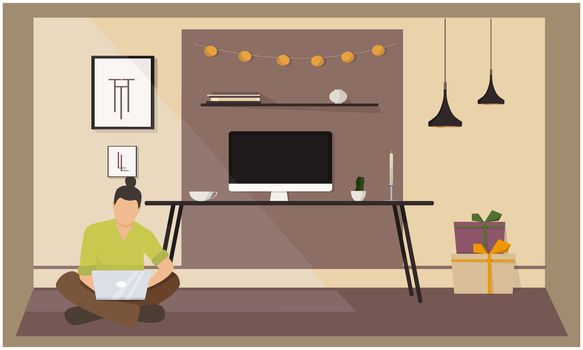 man is working on laptop, sitting on ground in his home