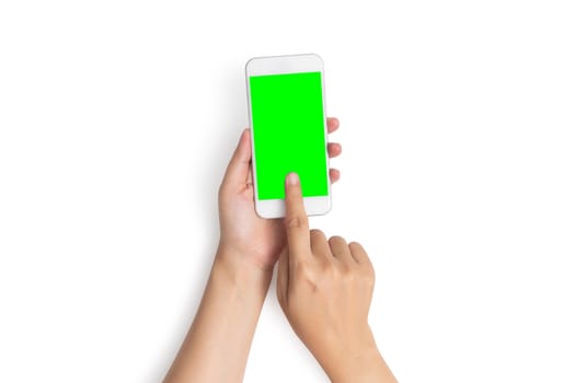 woman hand use finger touch on mobile phone button with blank green screen from top view, isolated on white background with clipping path