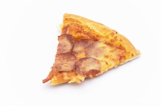 Pizza slice on over white background. Selective focus.