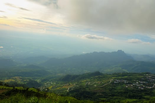 The mountain views of Phu Thap Boek are foggy and the morning sun.