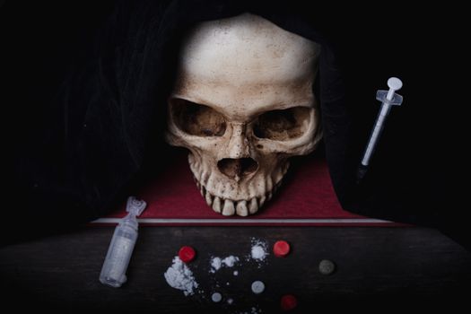 Still life of human skull that died for a long times ,concept of horror or thriller movies of scary crime scene ,The concept of people who die with drugs and Halloween theme, visual art