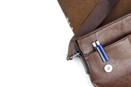 Sling bag with pen on white background.