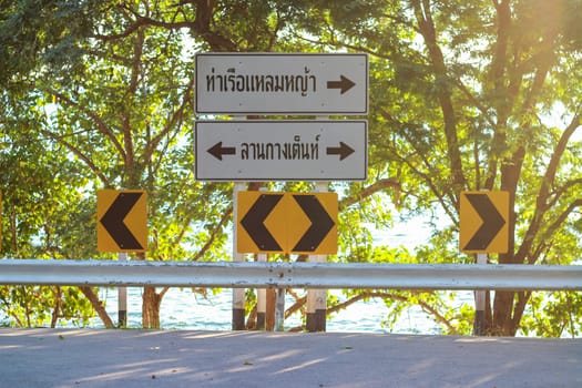 sign indicating the left path to the camping tent On the right is Laem Ya Pier. And there is sunshine in the Khao Laem Ya National Park, Rayong