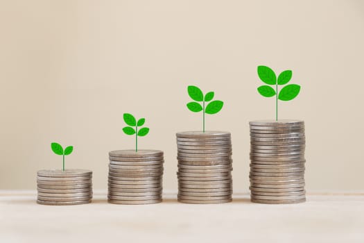 Silver coins arranged in a graph with there are trees on top.