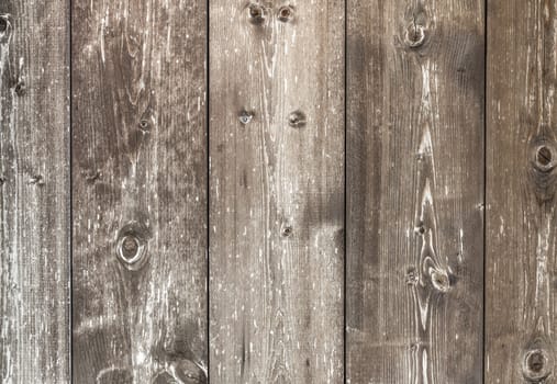 Horizontal wooden plank with knots, pattern of natural aged color.