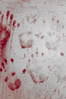 Grunge background with a print of a bloody hands. Ideas for background Halloween.