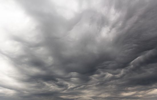 Dark ominous grey storm clouds. Dramatic sky.