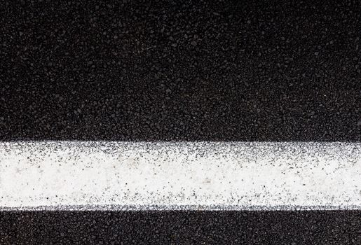 Tarmac background and texture. White line on road.