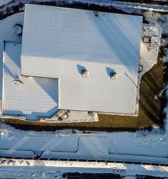 Admission with the drone from the air, winter, snow, big hall coverd with snow